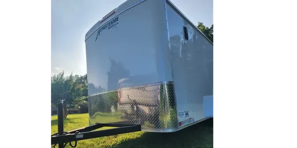 6 x 12 enclosed cargo trailer parked on grass