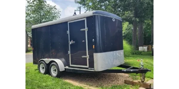 7 x 14 enclosed trailer parked on grass
