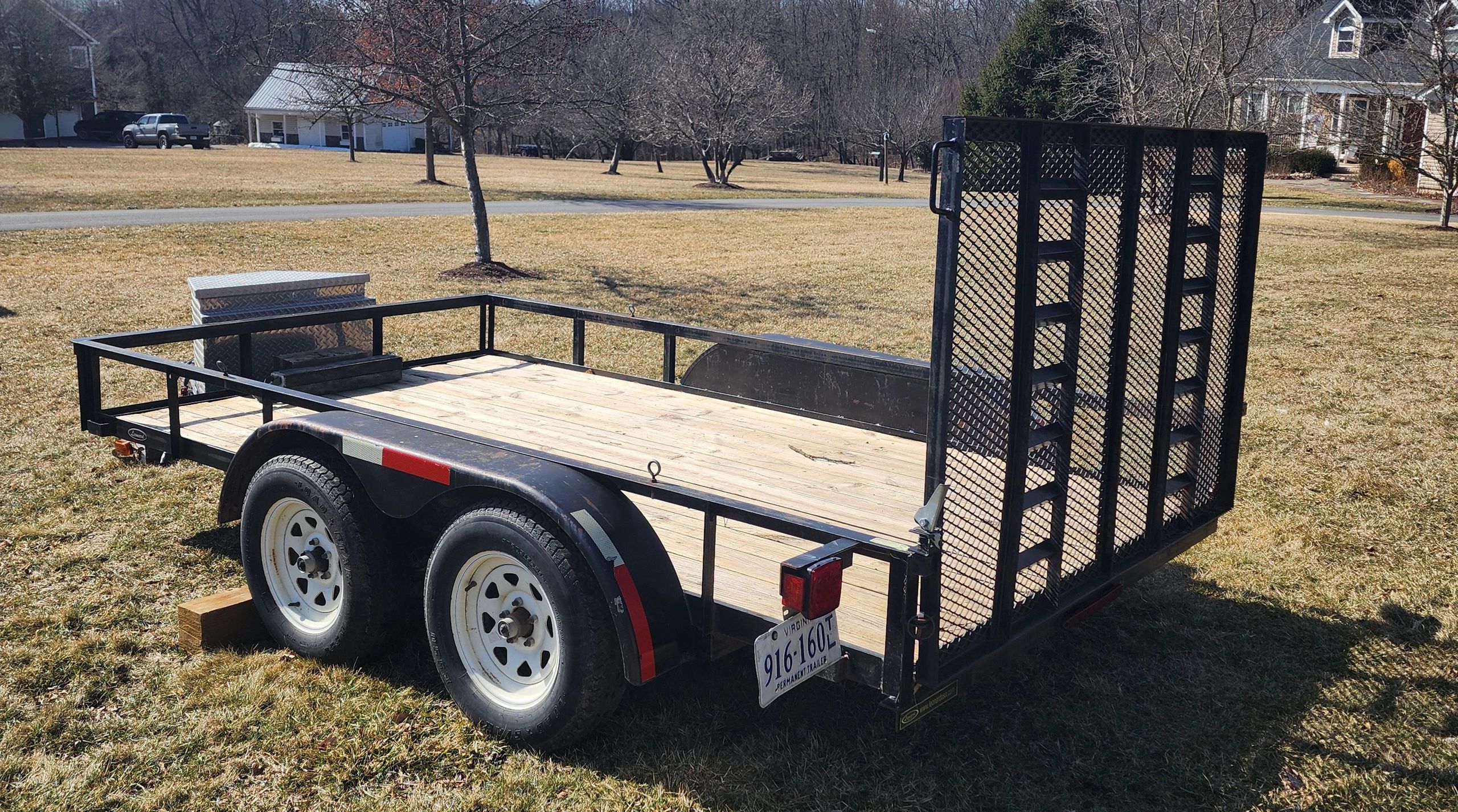 6 x 12 utility trailer with wooden deck and mesh gate